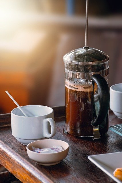 Image of a French Press of coffee ready to be poured