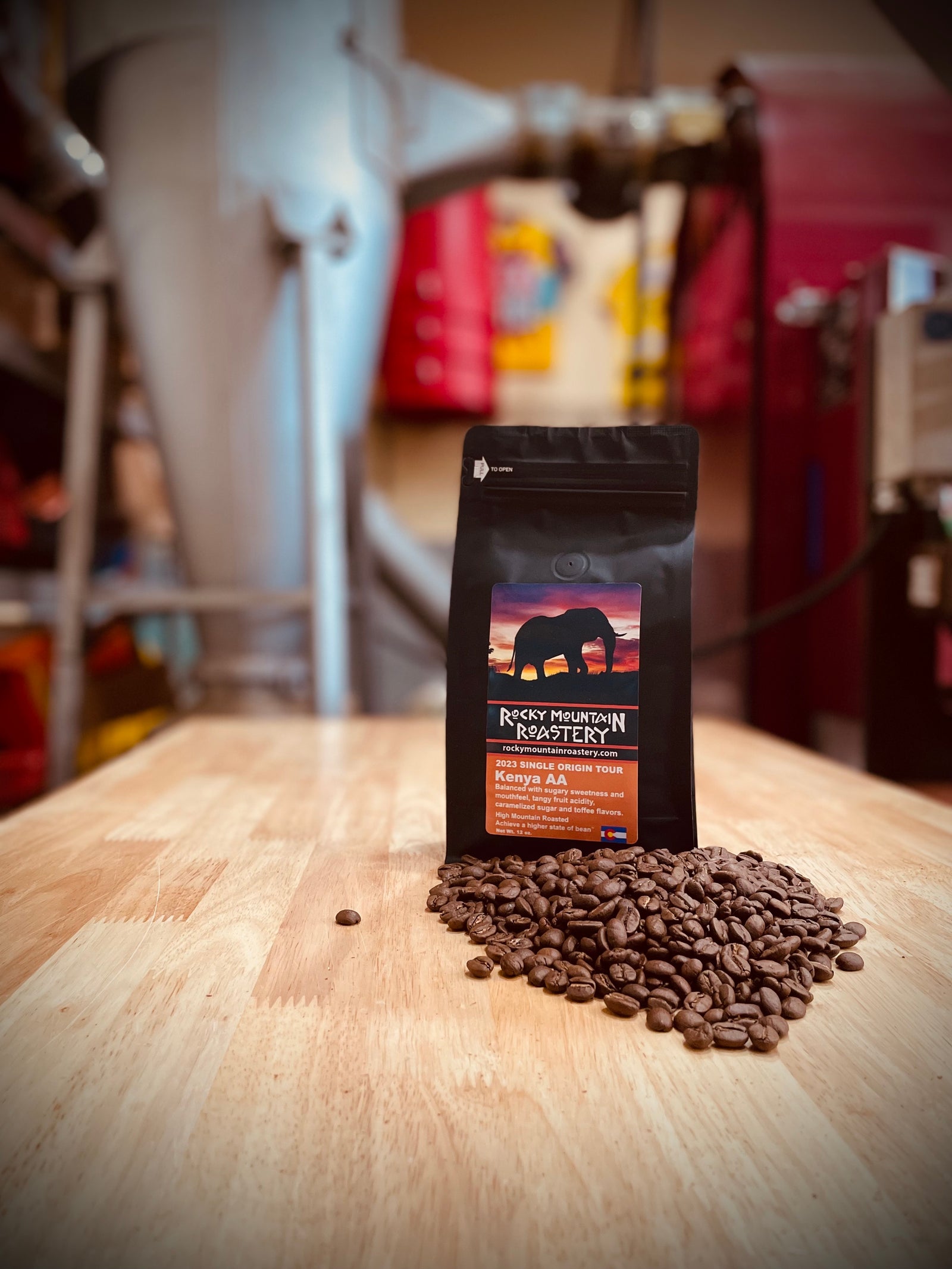 Picture of a bag of Kenya AA surrounded by coffee beans